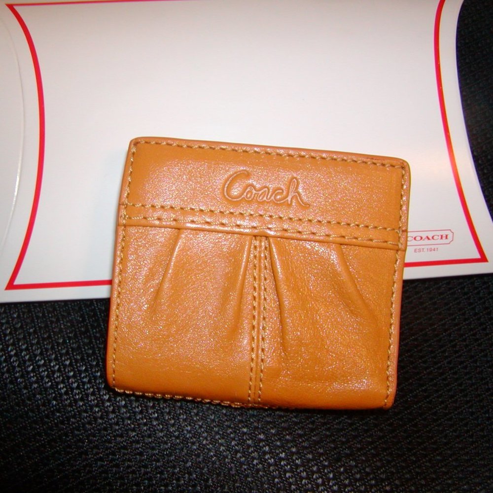 Small pocket size COACH Wallet. Holds cash, cards, and coins. TAN Leather.